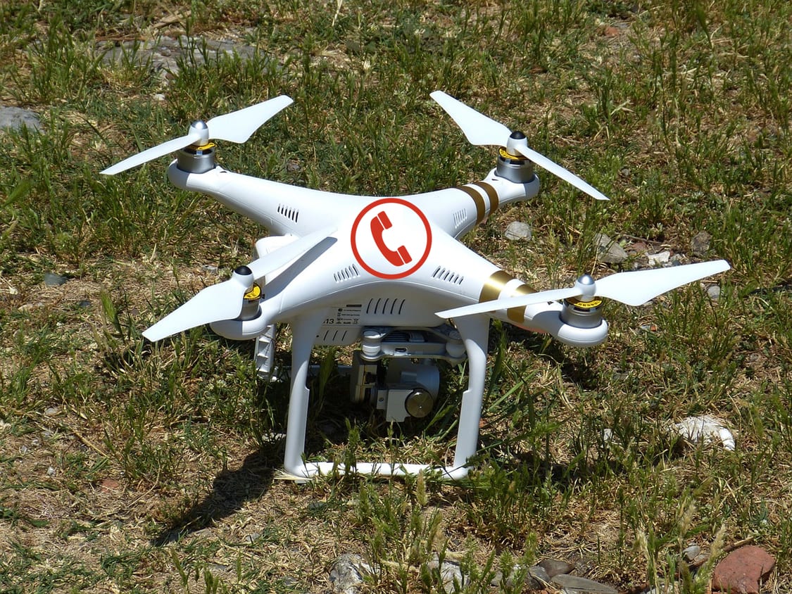 Image of a drone with a phone icon on top