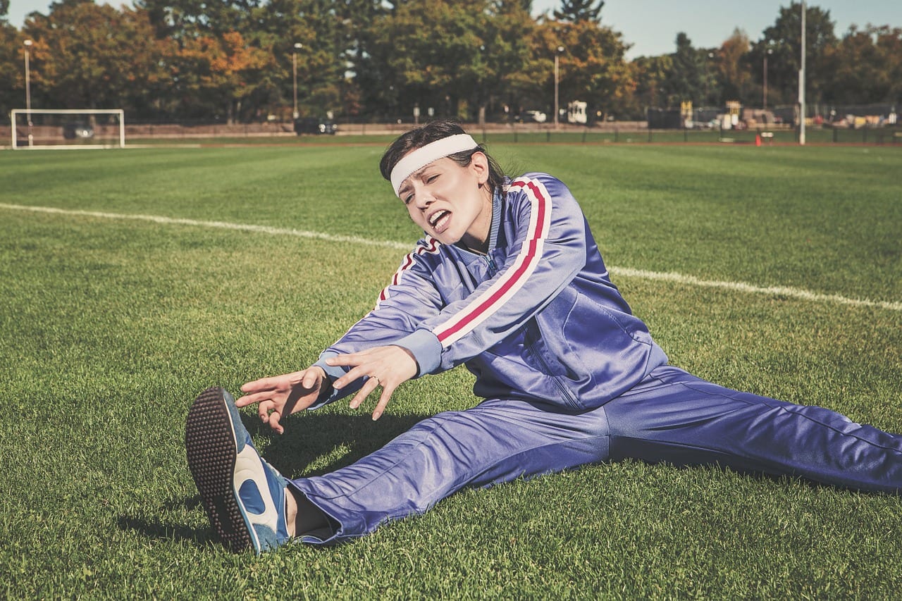 Image of a person stretching as part of their progressive training efforts
