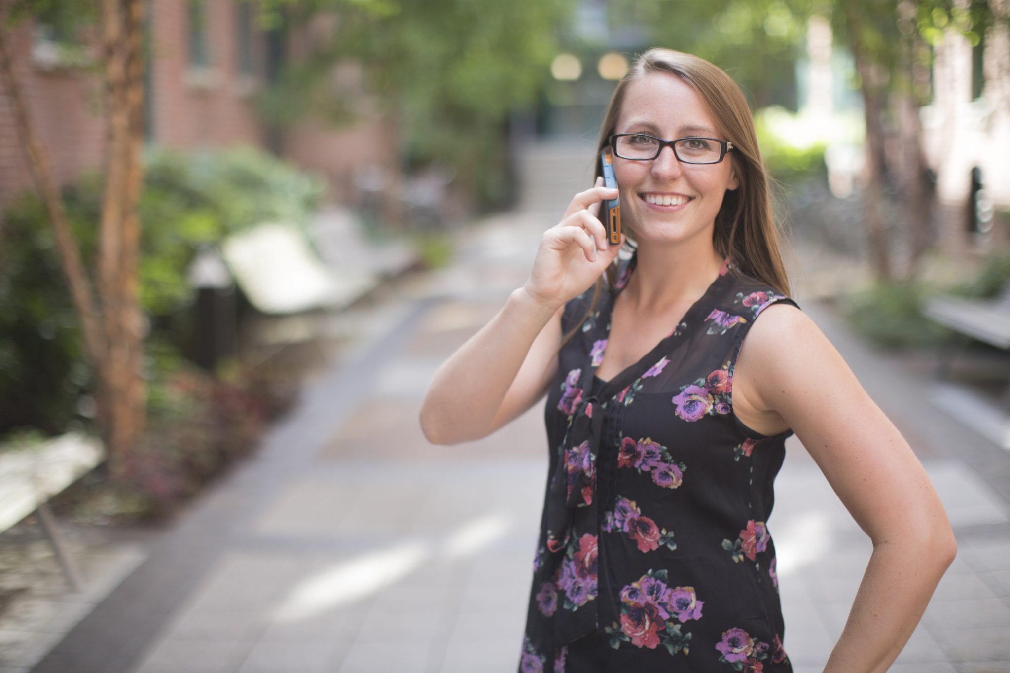 Image of a woman talking on the phone with an answering service