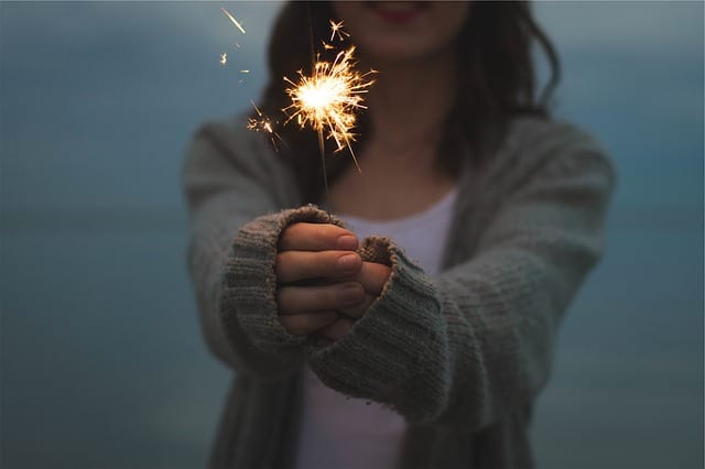 Image of a person holding a sparkler to celebrate 2015