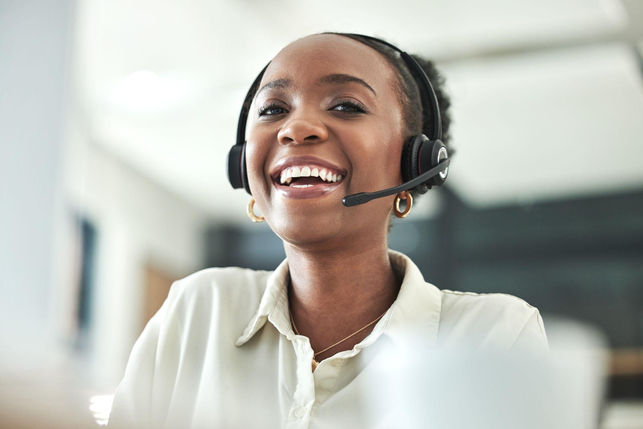 Call center and laugh portrait with a smile in a office with contact us work. 