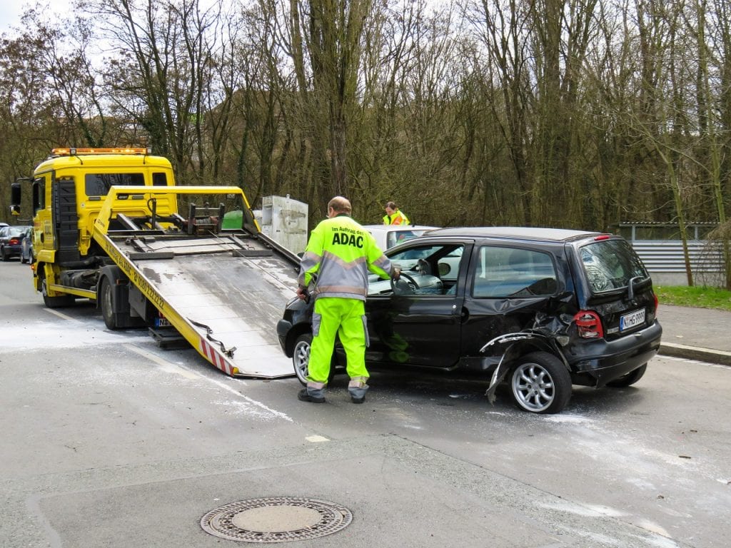 Image of a car being towed by a towing service that uses an answering service