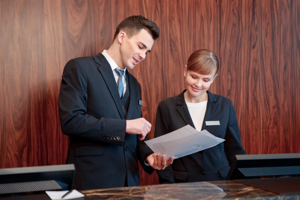 workers at a front desk