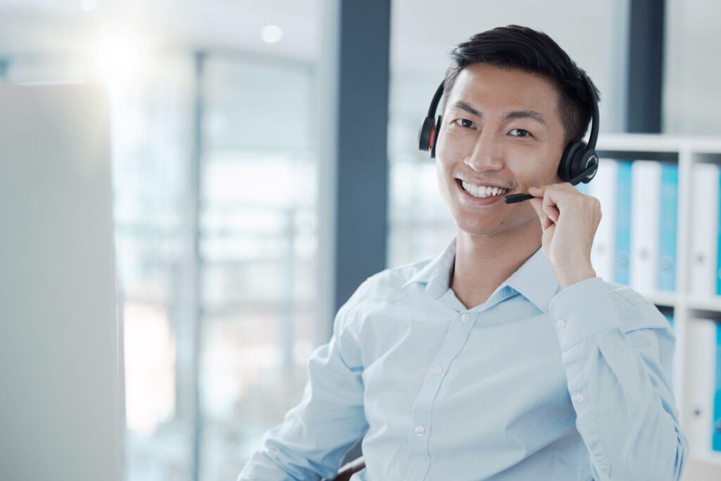 Professional customer service communication employee in online consulting workspace with headset.