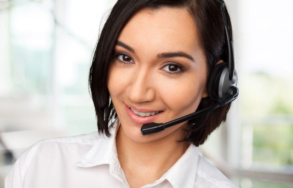 smiling customer service represenative with headset