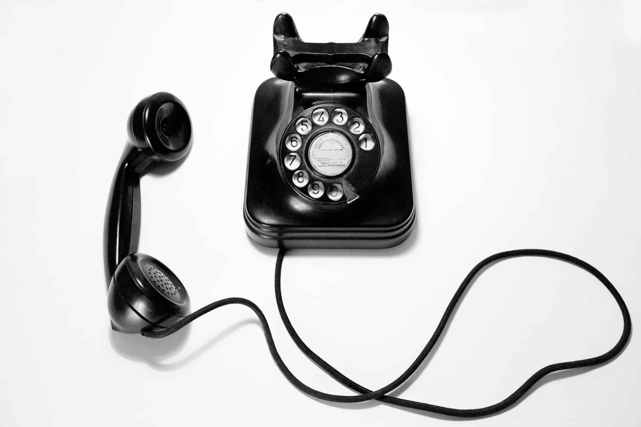 black retro telephone with the taken off receiver