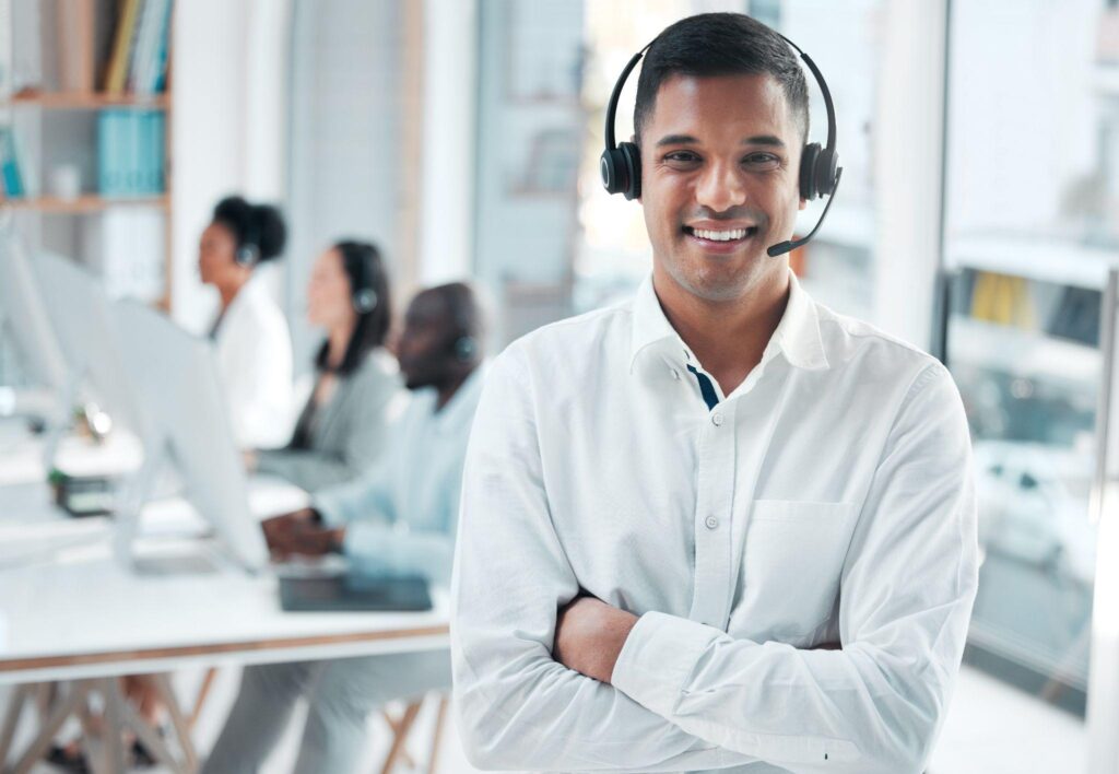 Male customer service agent in white shirt.