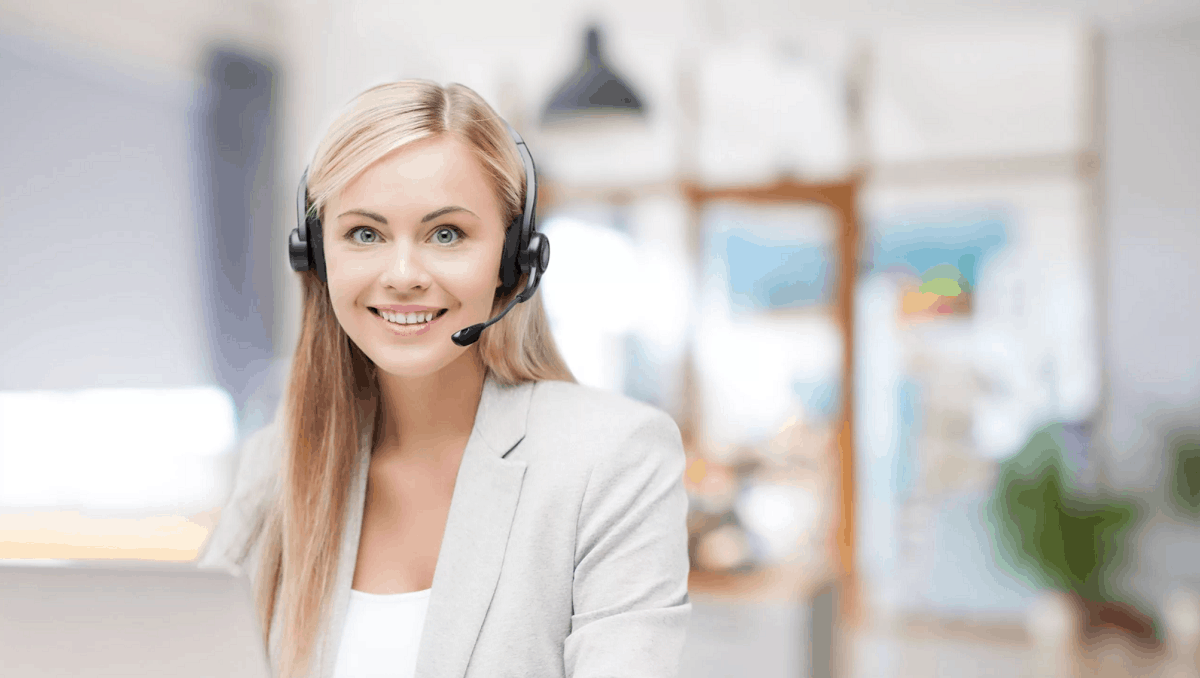 female helpline operator in headset working at office