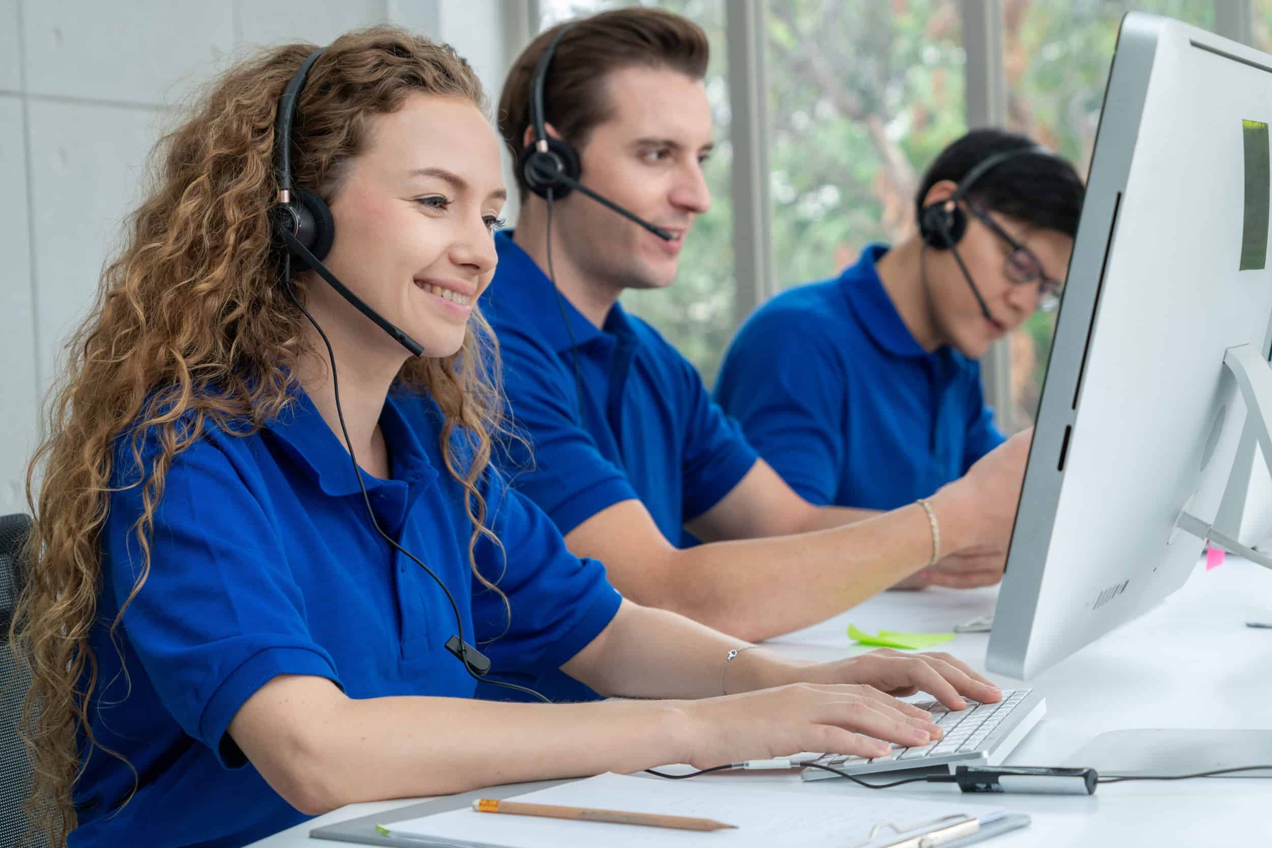Business people wearing headset working in office to support remote customer