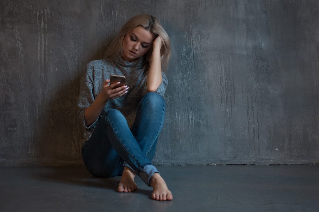 woman dialing a mental health professional