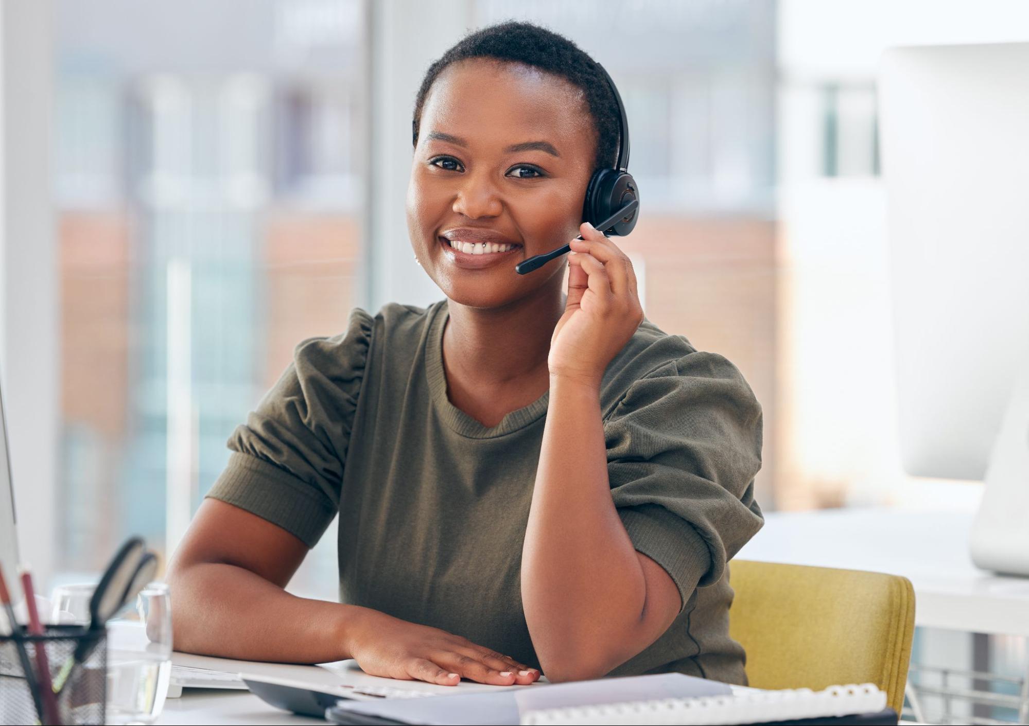 Shot of a woman wearing a headset while working in a call center.