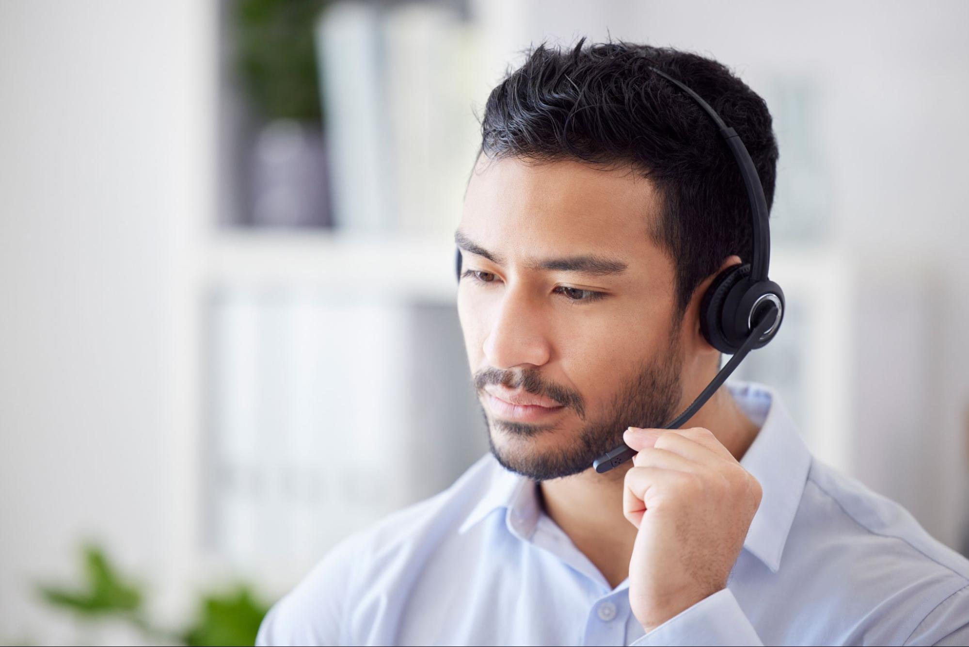 Man, focus and agent with telemarketing, call center and help with customer service.