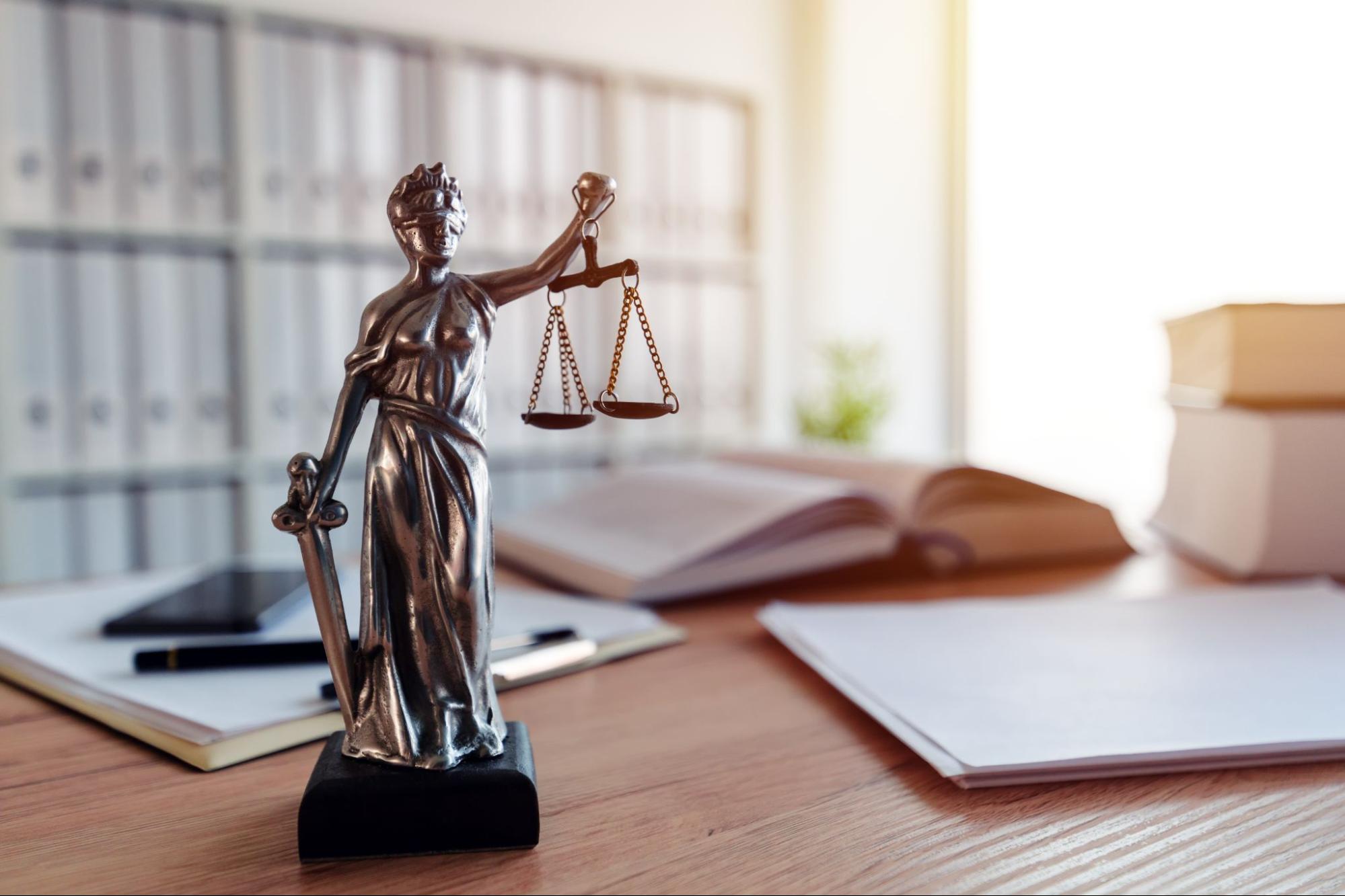 Lady Justice statue in law firm office.
