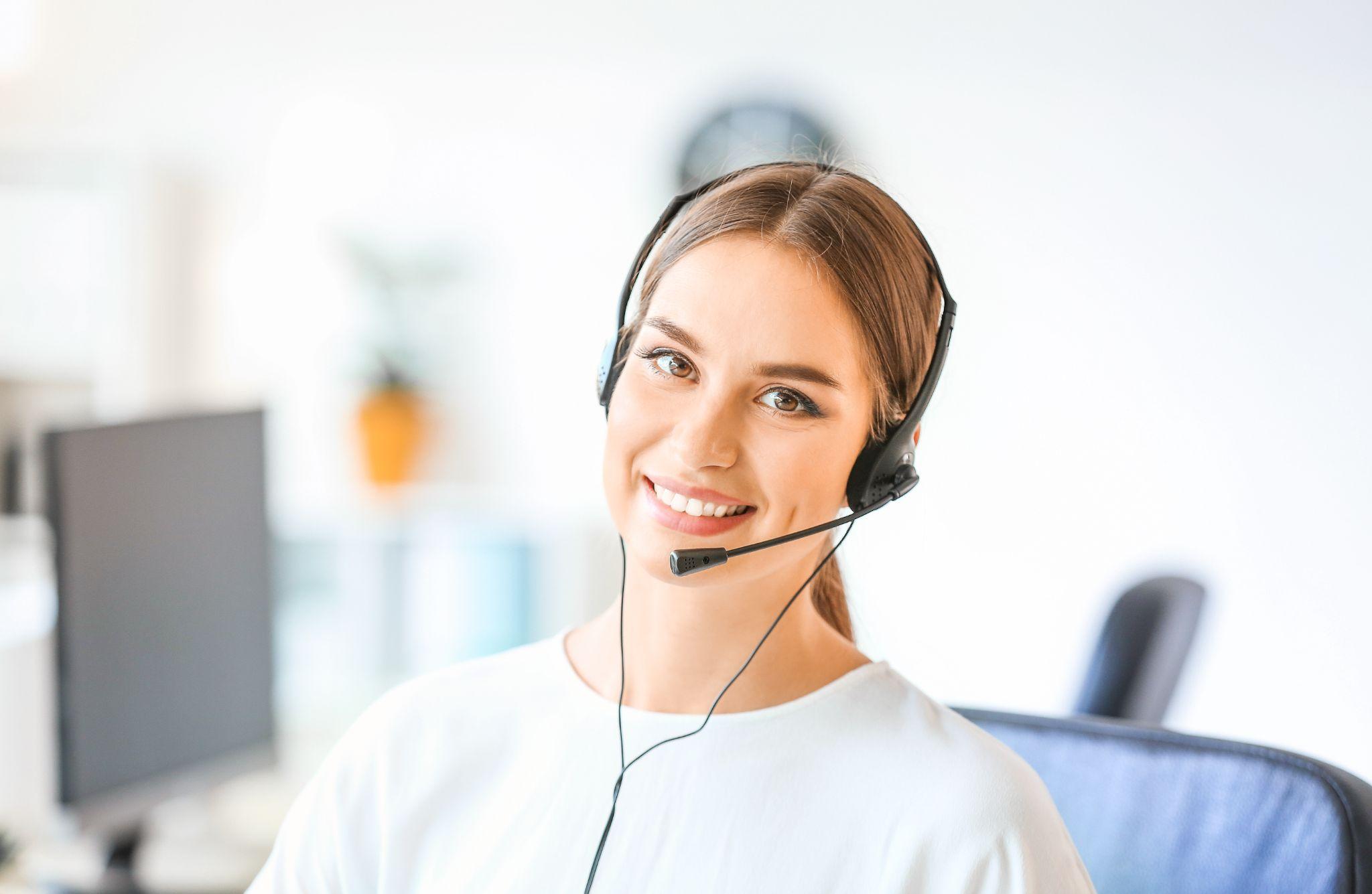 Female technical support agent working in office