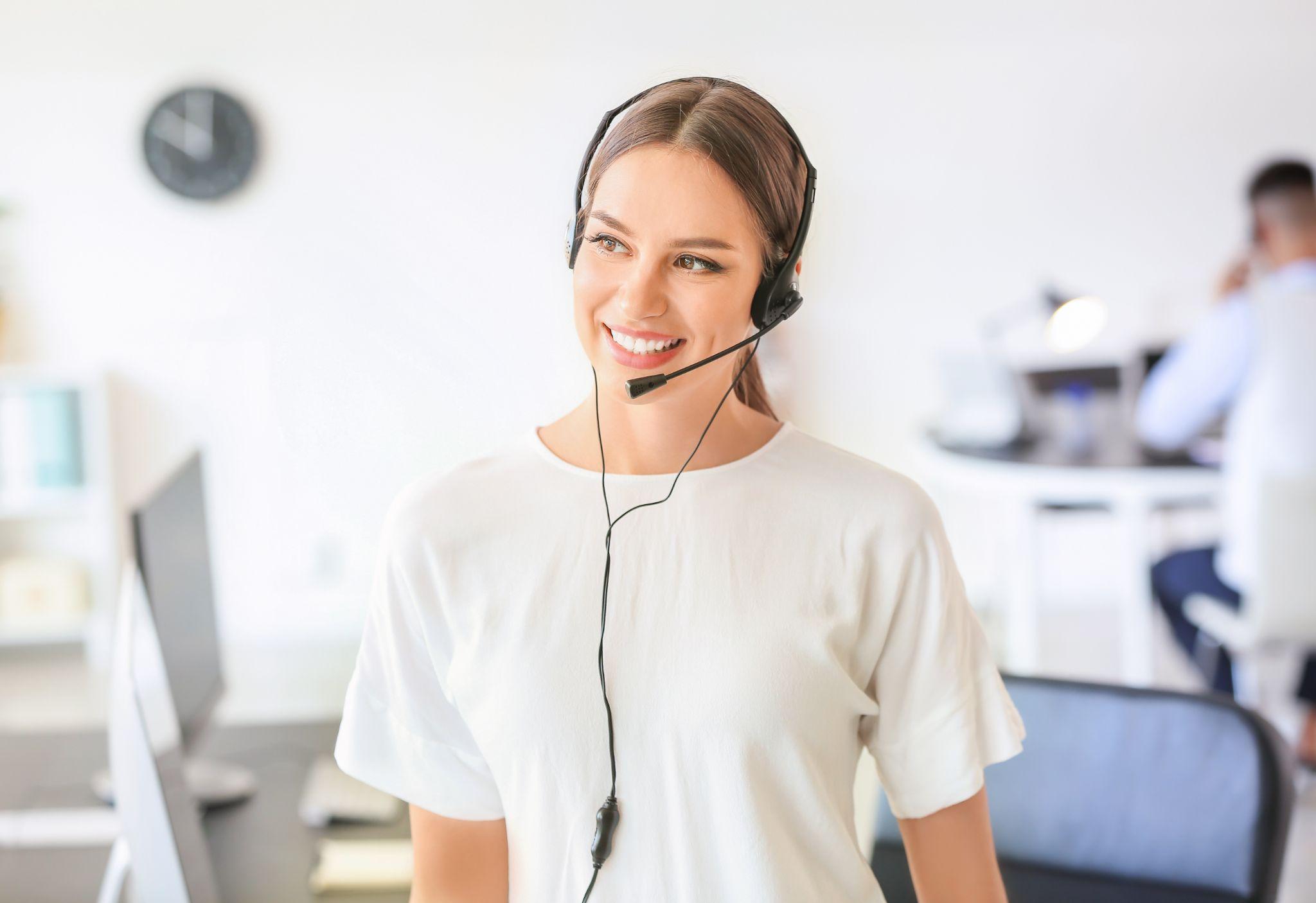 Female technical support agent working in office