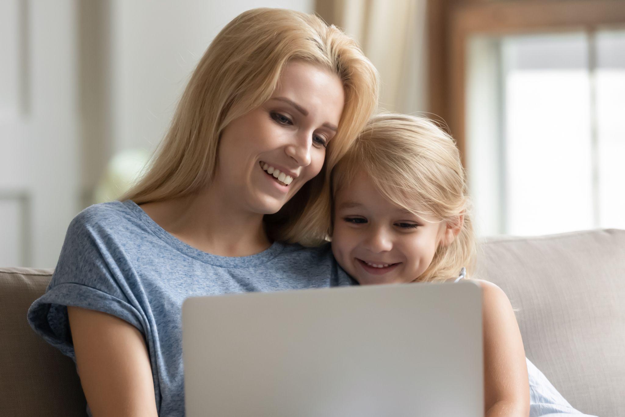 loving caring mother spend time with little daughter at home