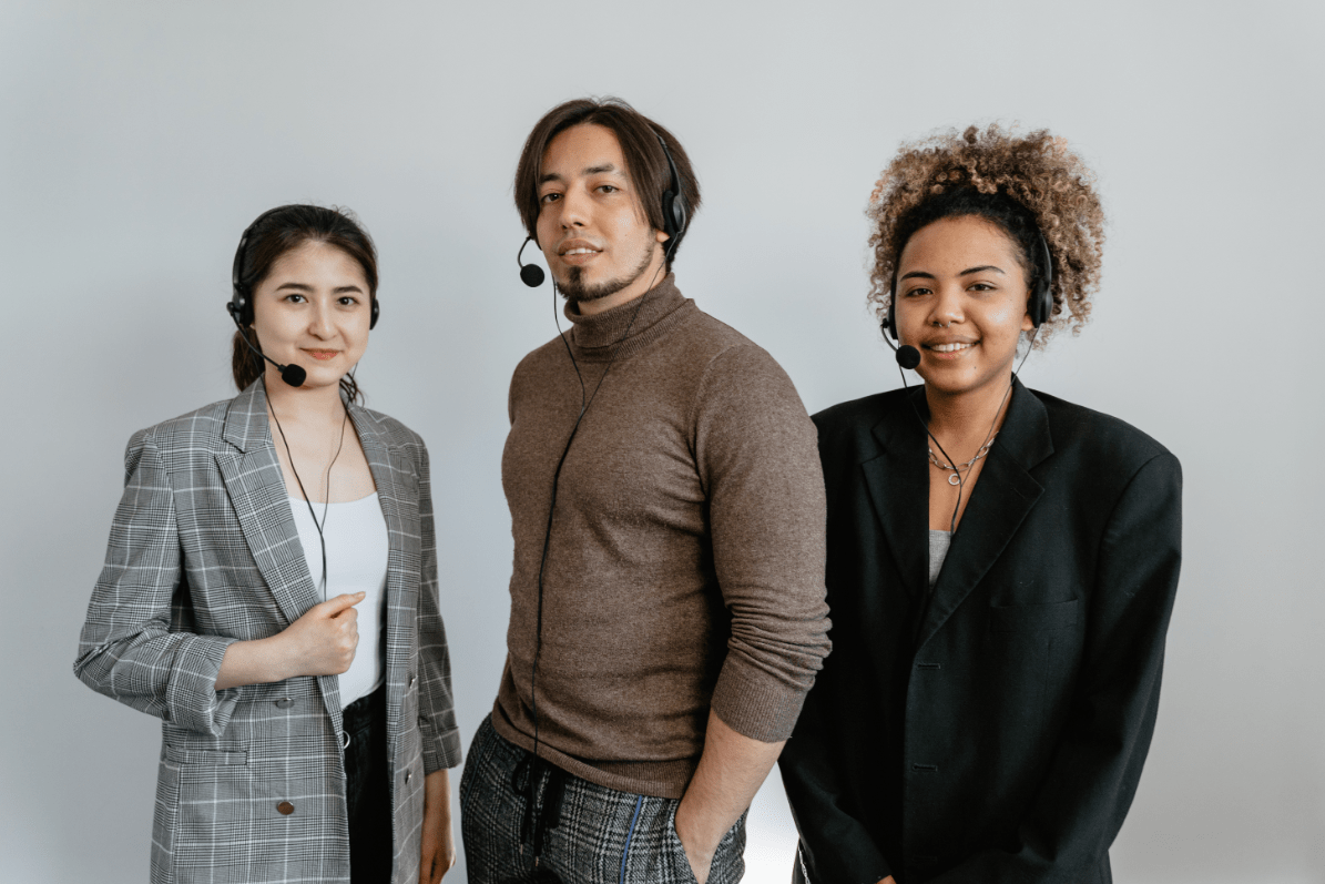 Three customer service agents with headsets.