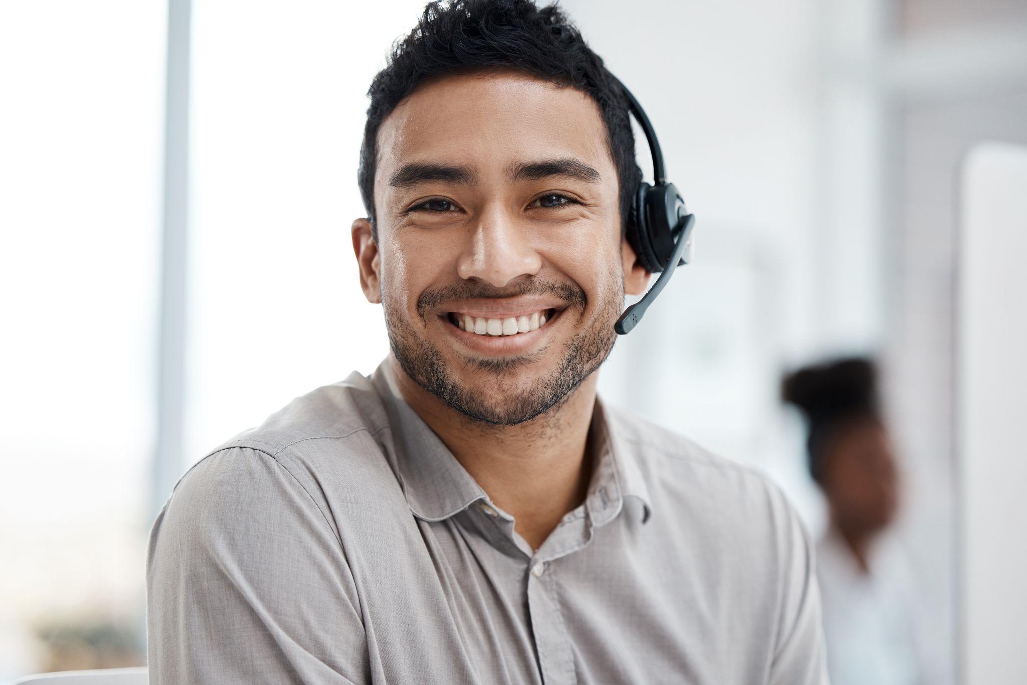 Male customer service agent with headset.